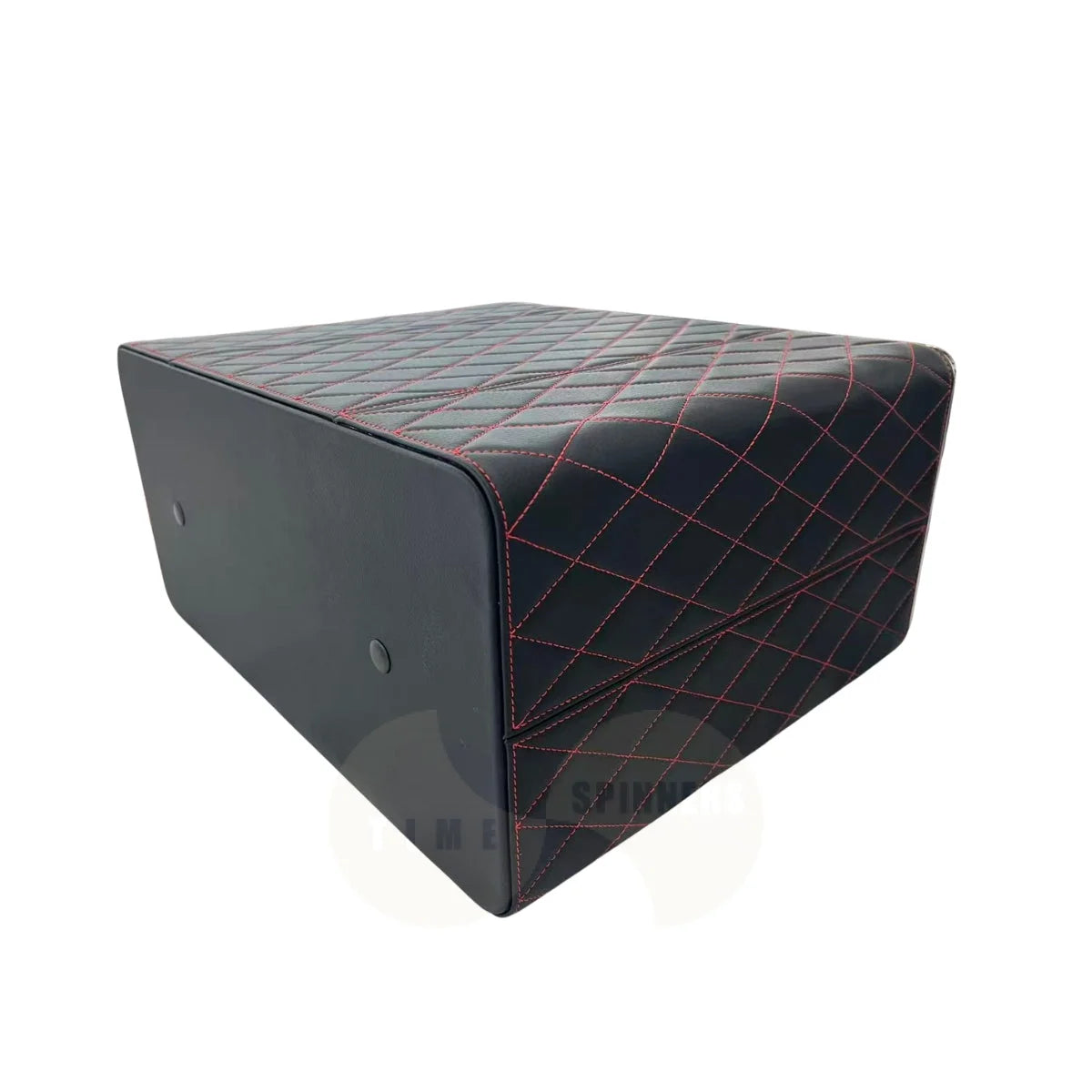 A black leather cube ottoman with red diamond-quilted stitching on the top and side, shown at a three-quarter angle on a white background.